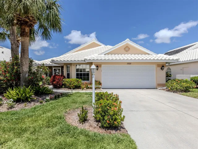 The epitome of a gorgeous Florida home, complete with a tile roof.