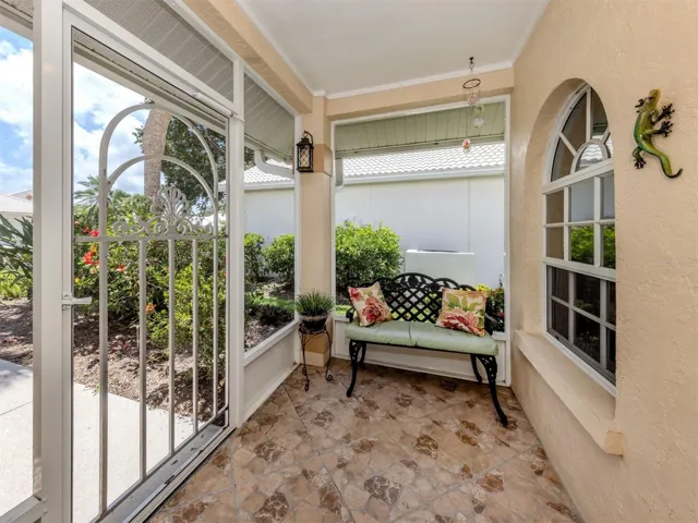 The unique tile flooring in the front porch adds charm to this entrance.