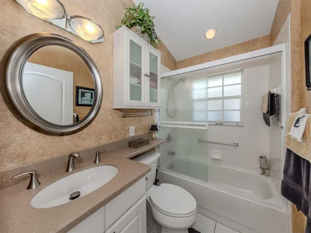 The guest bedroom has a tub/shower combination.