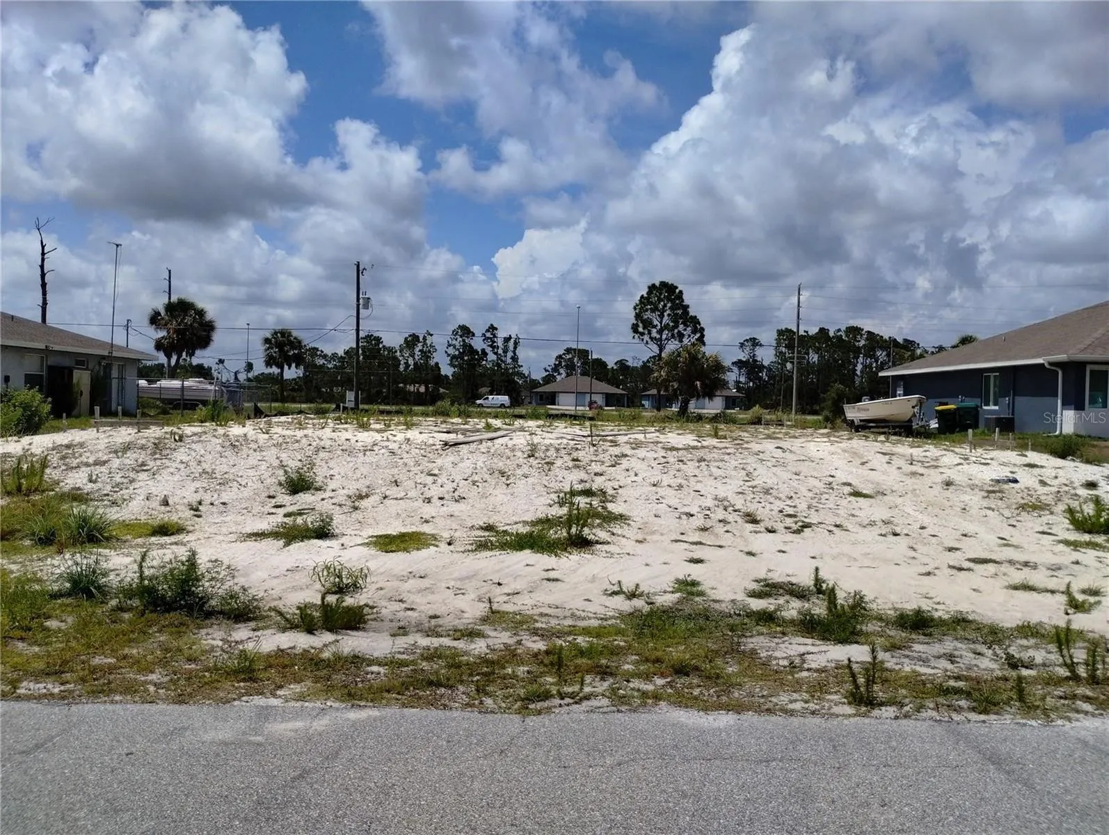 Front view of cleared lot w/fill dirt