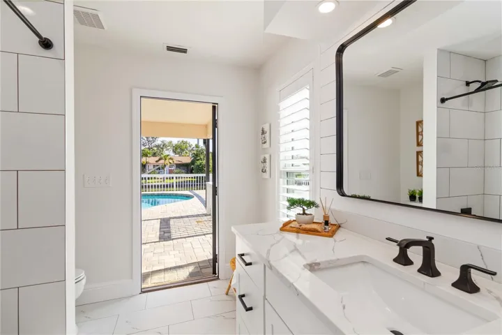 Bathroom 2 opens to the pool.