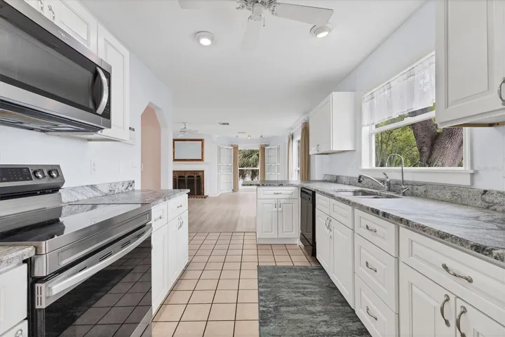 Updated Kitchen with granite countertops and canal views