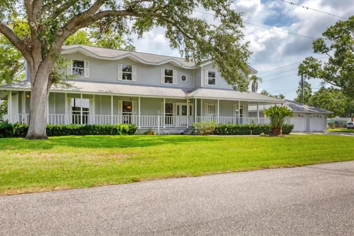 Grand colonial on canal with large corner lot