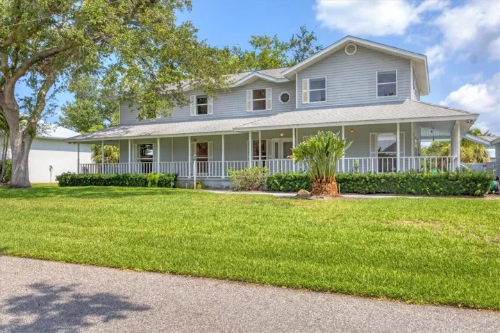 Grand colonial on canal with large corner lot