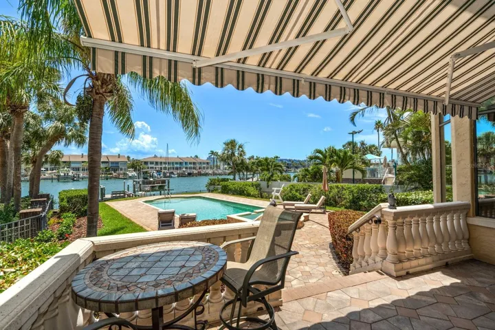 Retractable awning over the balcony overlooking pool