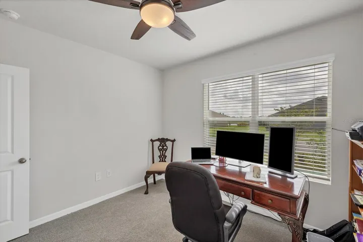 Bedroom #1 facing street setup as office