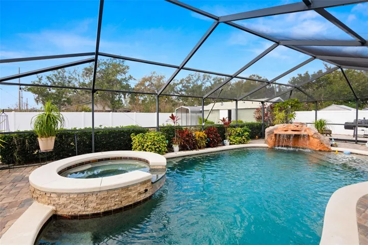 Saltwater Pool with Spa & Water Feature, surrounded by pavers.