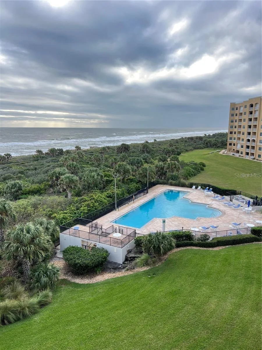 View from balcony to heated oceanfront pool