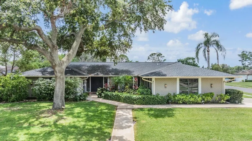 Welcome to 475 Holly Hill Rd 4/4 + Bonus/Office with on a large corner lot with attractive landscaping and front entry for eye -catching curb appeal