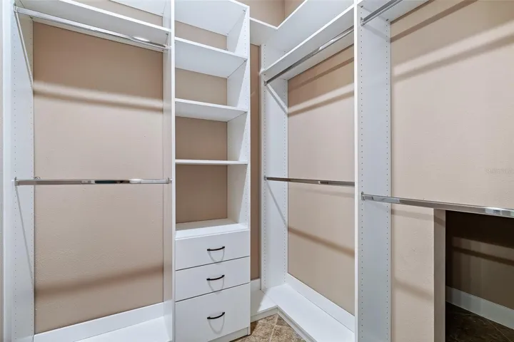 Primary Bedroom Walk-in Closet w/Custom Built-ins