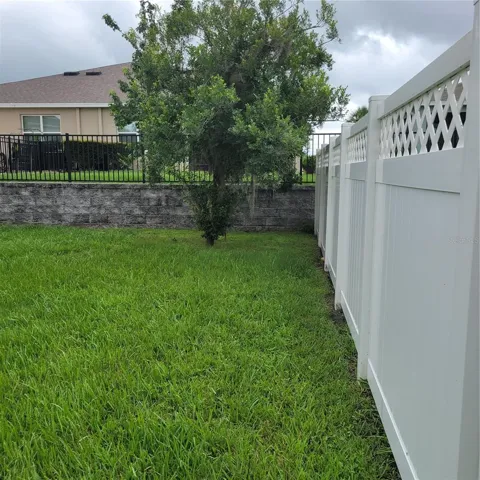 Right side fenced back yard