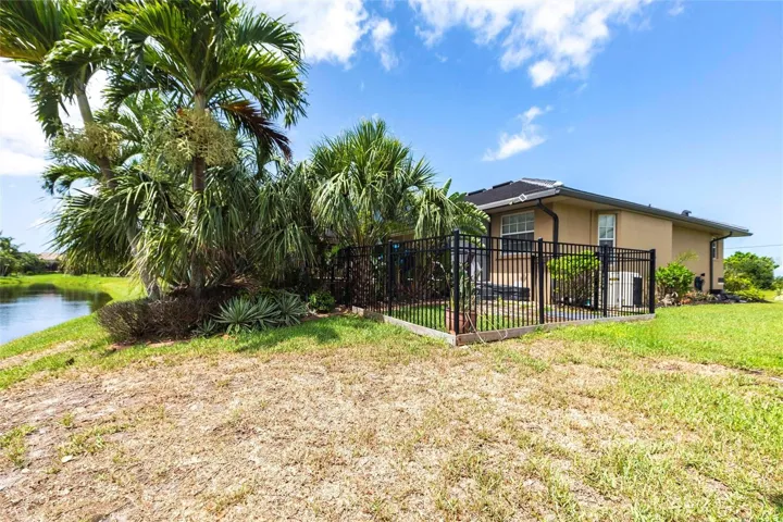 Pet-friendly backyard featuring a fenced dog run and open green space—perfect for safe play, exercise, and outdoor enjoyment.