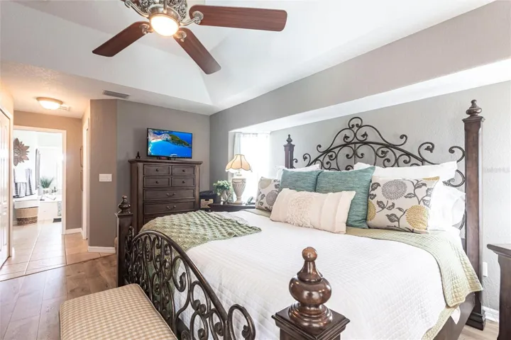 Relaxing primary bedroom with refined finishes and natural light.