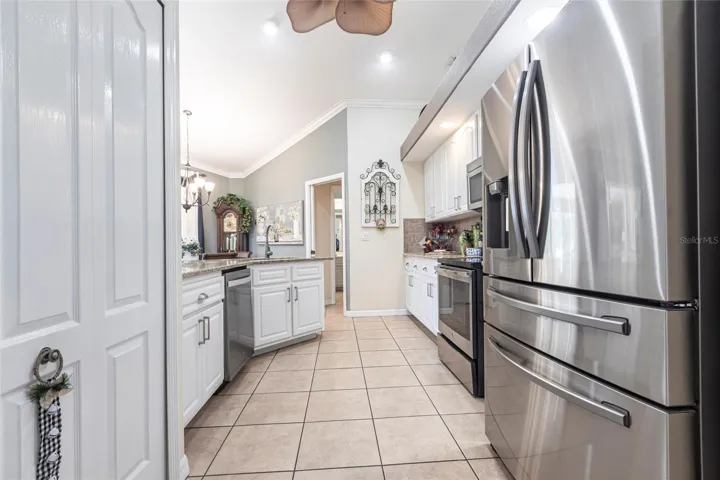 Well-appointed kitchen with granite countertops, stainless steel appliances, and breakfast bar