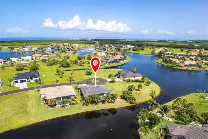 Bird’s-eye view highlighting the home’s desirable lakefront location and surrounding community.
