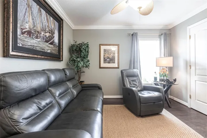 nviting den with refined finishes and flexible living space