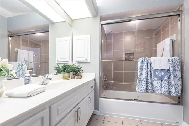 The main bath opens to the pool area.