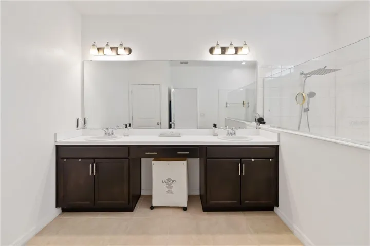 Dual sinks in light and spacious Master Bathroom
