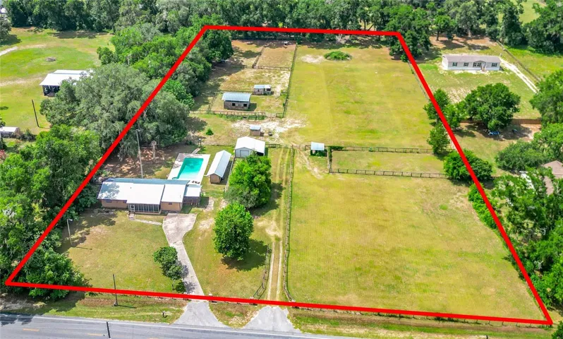 Aerial shot zoomed in. Right side is perfect to build a new home/ guest house.