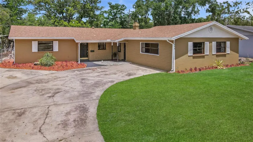 Gorgeous, Immaculate and JUST-RENOVATED Four-Bed, Two-Bath, Concrete-Block Single-Family Home with a Sparkling SCREENED POOL, a FIREPLACE & a Sprawling Huge Enclosed GARAGE BONUS-ROOM on a Fully-Fenced Lot! HOLY COW