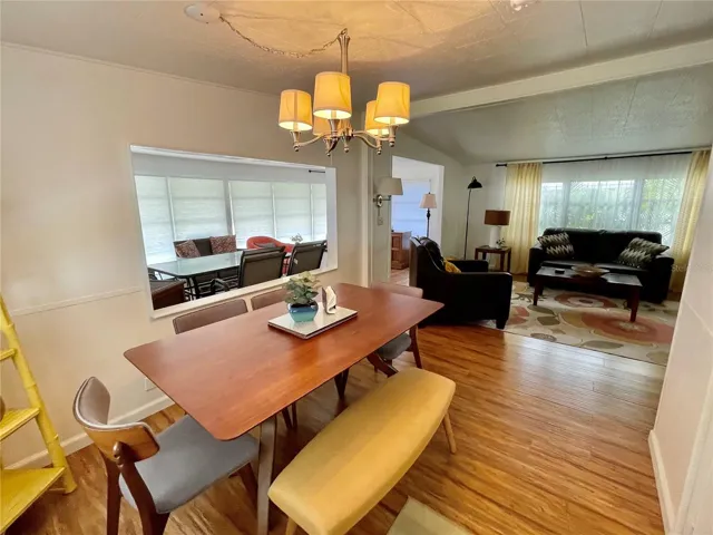 Walking in the side door from carport… this home is mostly furnished with a Mid-Century vibe!!