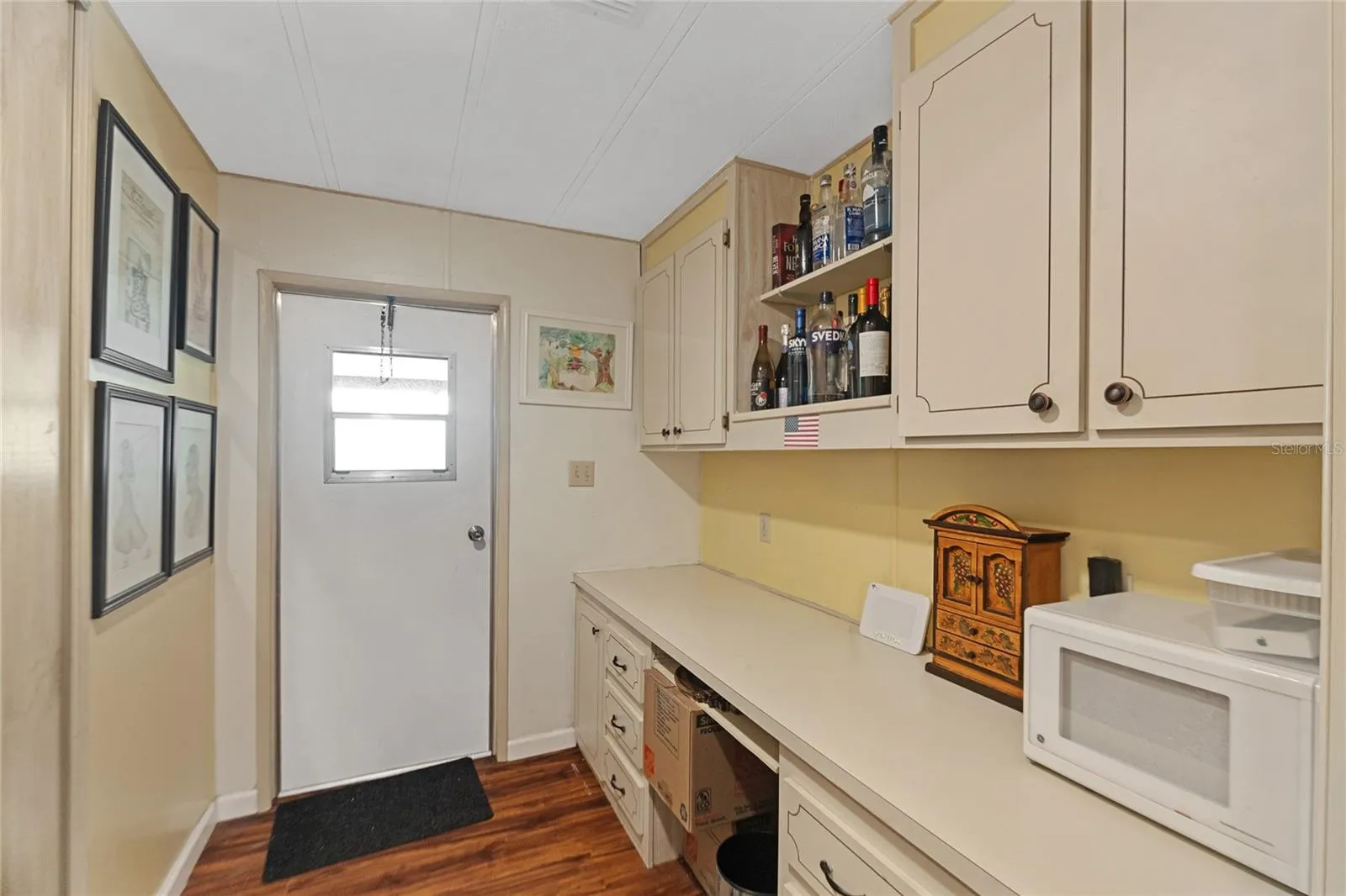 Office with built-in desk and cabinetry