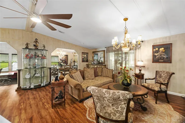 Living room open to family/front room space offers excellent entertaining options!