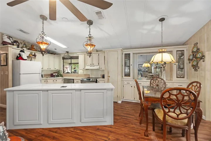 Open floor plan between kitchen, dining, and living room