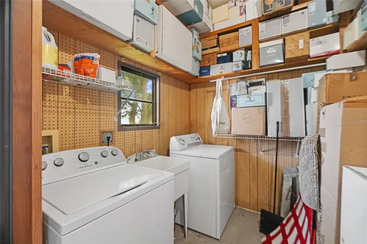 Laundry room with shelving up to the 9' ceilings