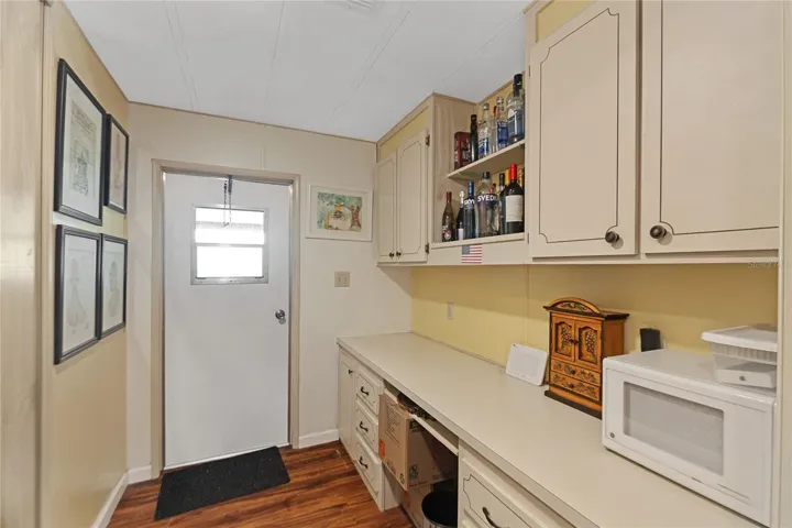 Office with built-in desk and cabinetry