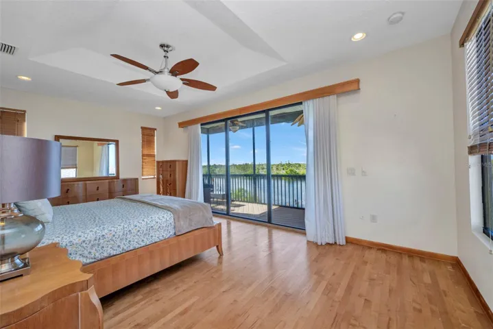 Primary bedroom with balcony
