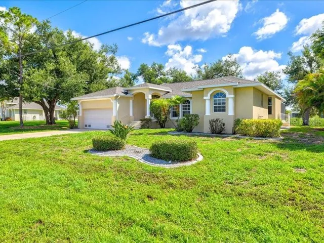This spacious 4Be/3be/2car gar water and golf course viewFURNISHED TURNKEY POOL HOME in the FIVE GOLF COURSES COMMUNITY OF ROTONDA WEST