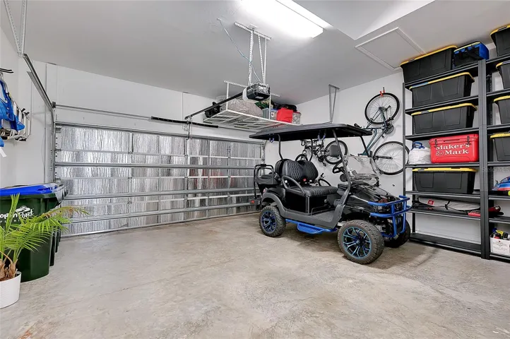 Insulated garage door to keep it cool and above storage bracets for extra space.