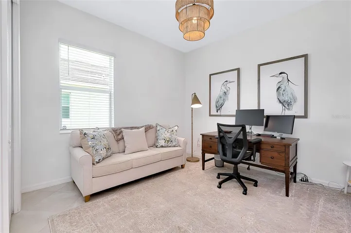 Third bedroom/den with pocket doors for privacy.