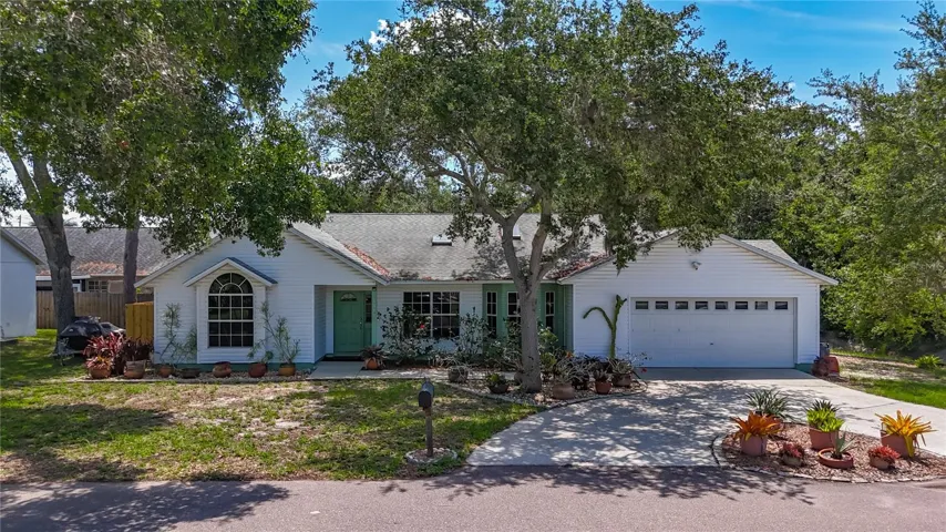 Custom Built in 1992. 3 bedrooms, 2 baths, oversized 2 car garage, inground pool/spa 1706 SF Unincorporated Pinellas County. Next to Joe's Creek. Convenient circular drive.