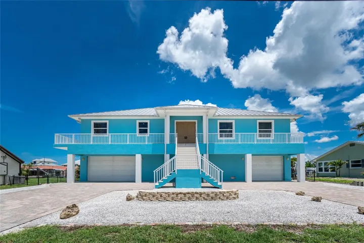 Built "STORM SMART"  with concrete block stucco construction all the way up, poured slab concrete floors, metal roof, and impact doors and windows.