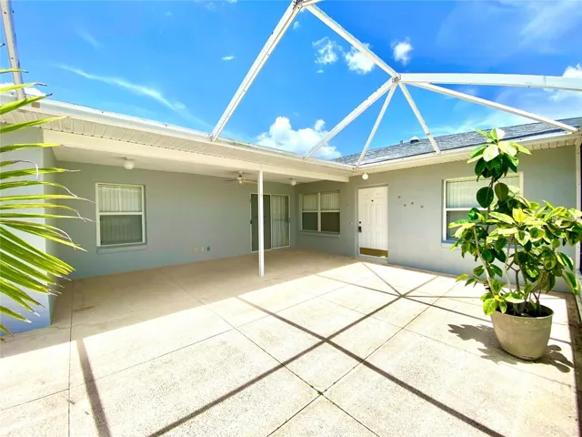 Patio with screen doors to kitchen area. 1129 Apple Terrace