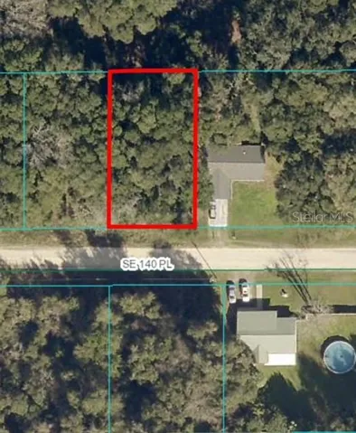 .23 Acre Lot (outlined in red)