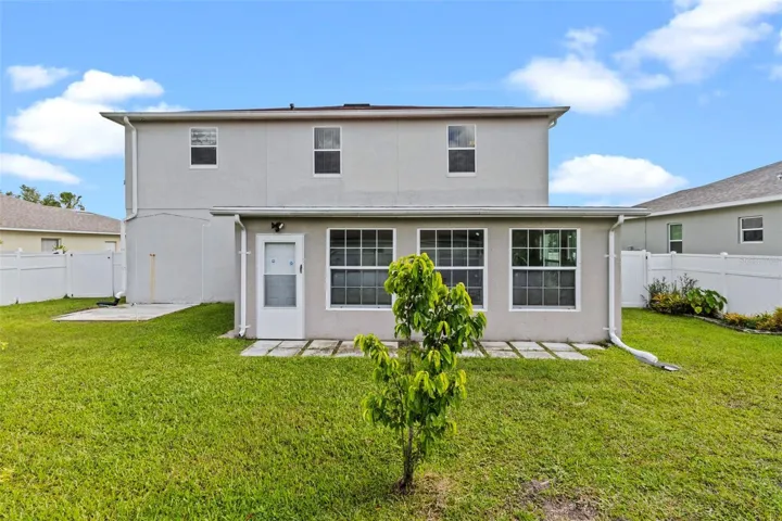 Back of home with Enclosed Porch