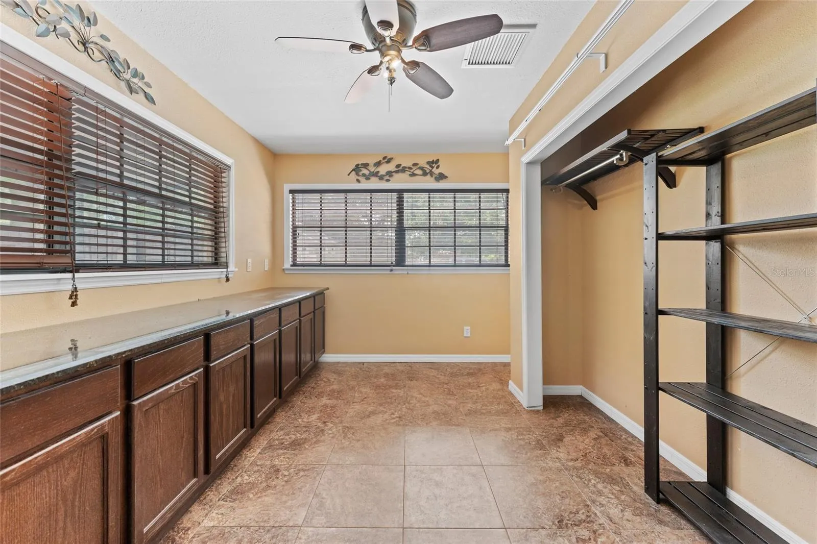 Office is 12' x 8', with ceramic tile, built-in cabinets, storage closet, and a ceiling fan.