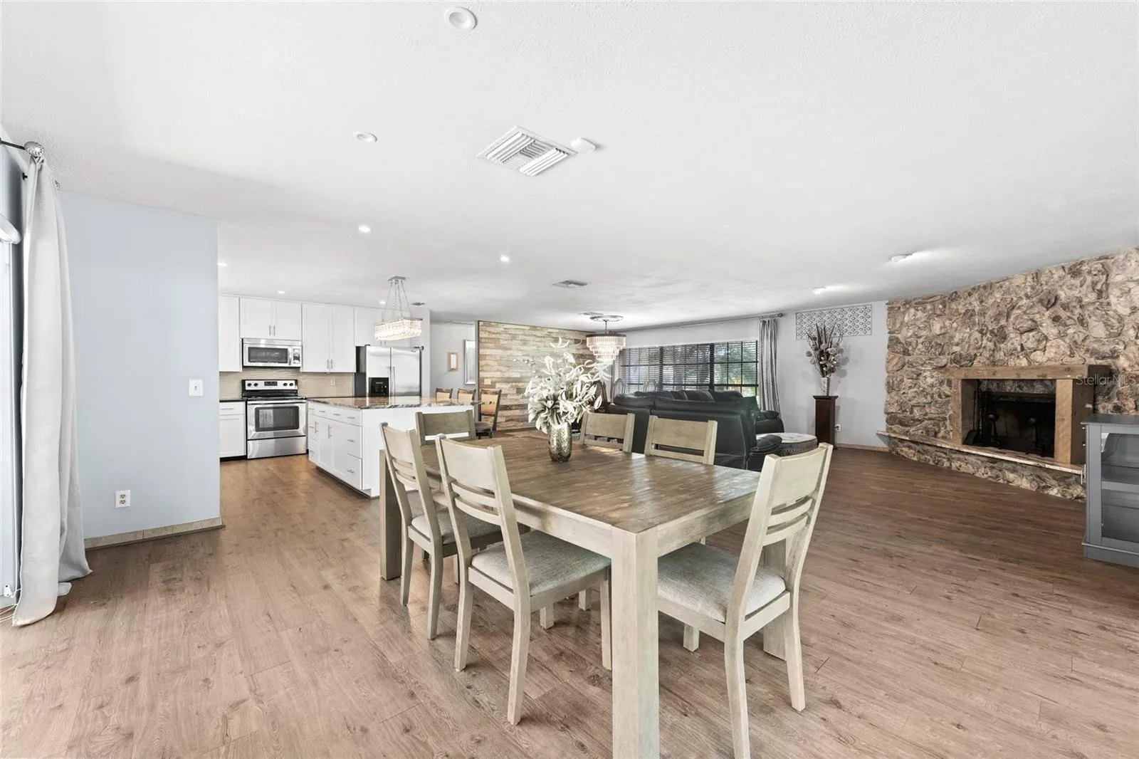 Expansive sliding glass doors fill the living and dining areas with natural light.