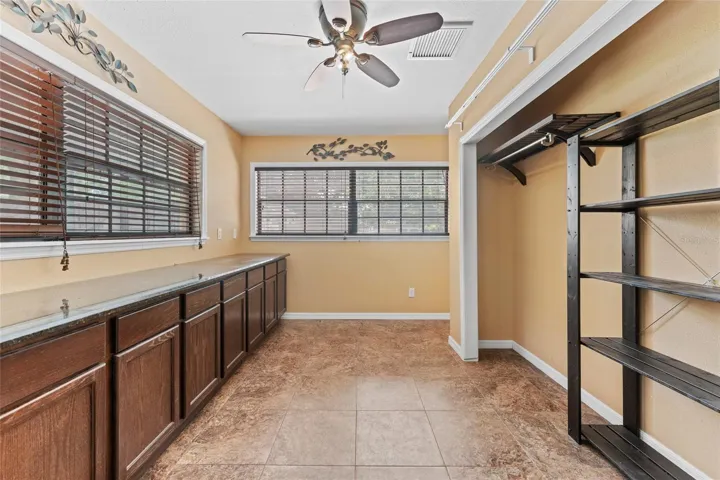 Office is 12' x 8', with ceramic tile, built-in cabinets, storage closet, and a ceiling fan.