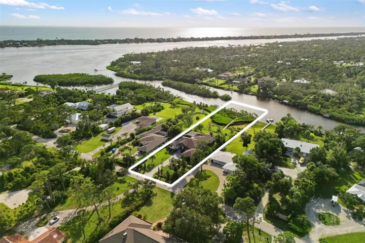 Over an acre of beautifully manicured land with waterfront Gulf access! This stunning property offers space, privacy, and the ultimate Florida lifestyle — bring your boat and enjoy direct access to the Gulf right from your backyard.