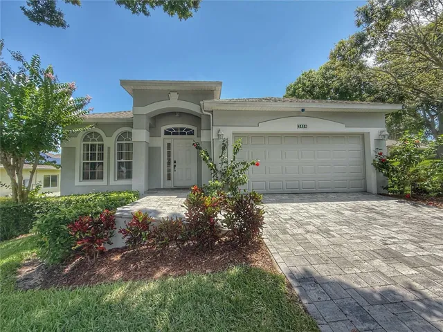 Front exterior w paver driveway, gutters, Roof 2025