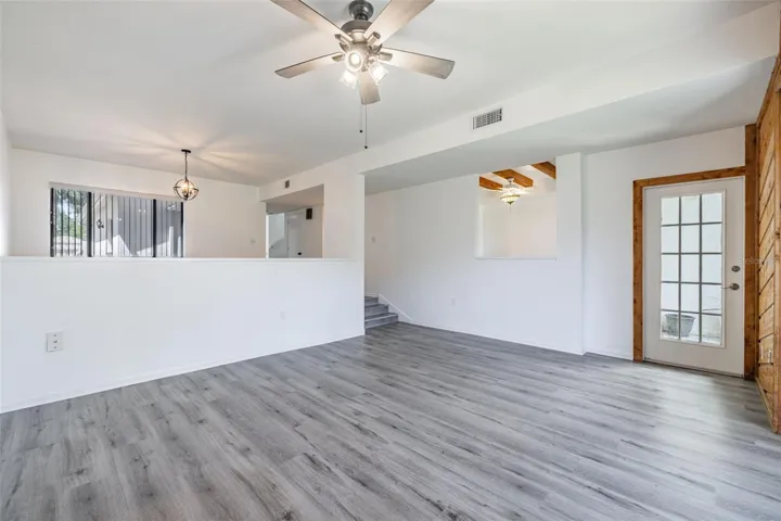 Living Room, looking back to Dining Area &amp; Exterior Door