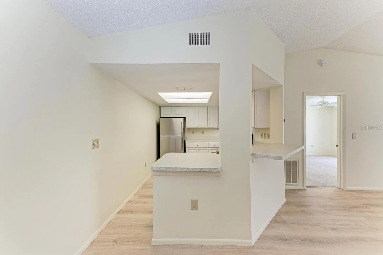 Kitchen straight ahead; living room on the right.
