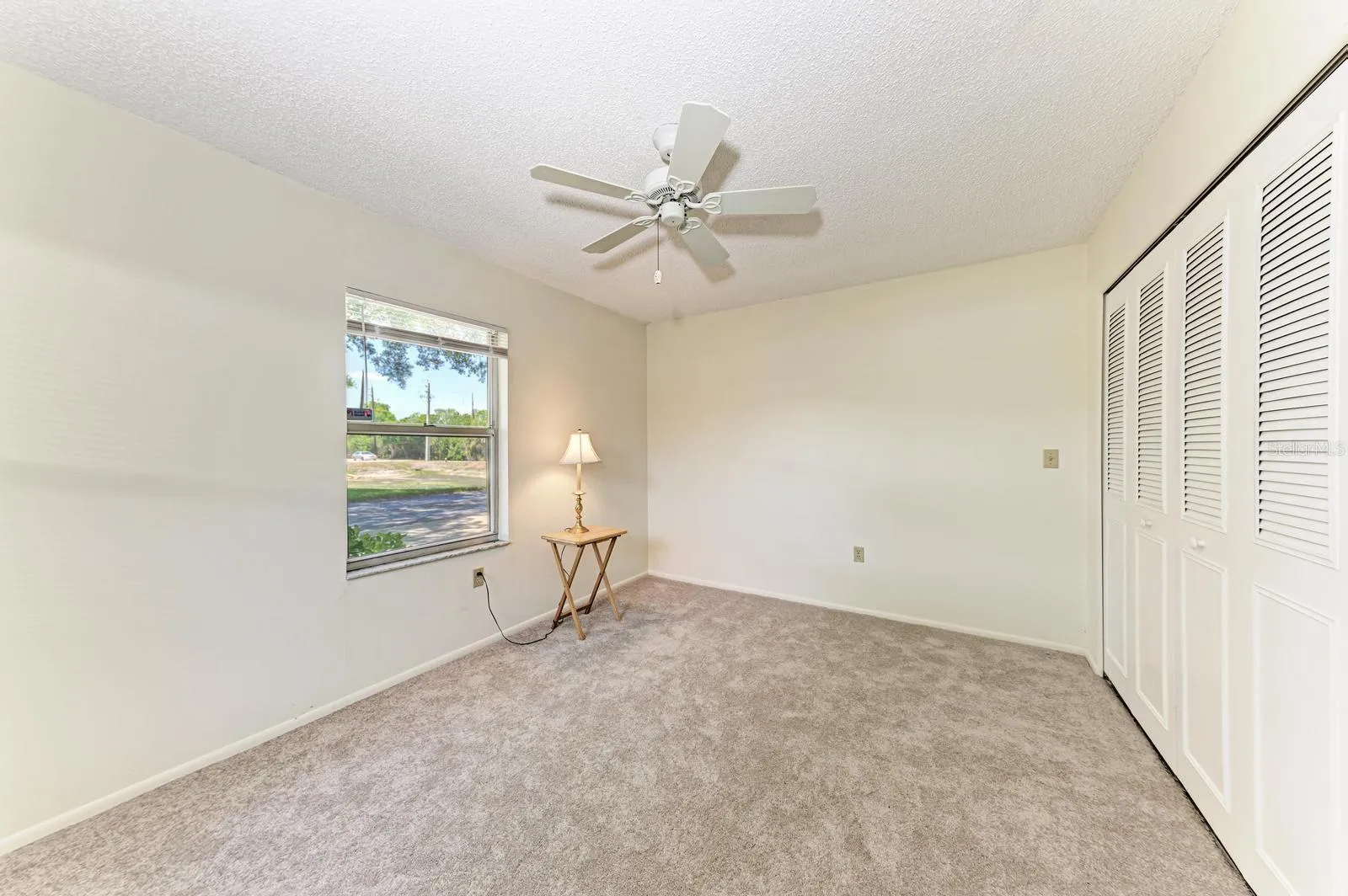 Guest bedroom.  Window is looking out at the street