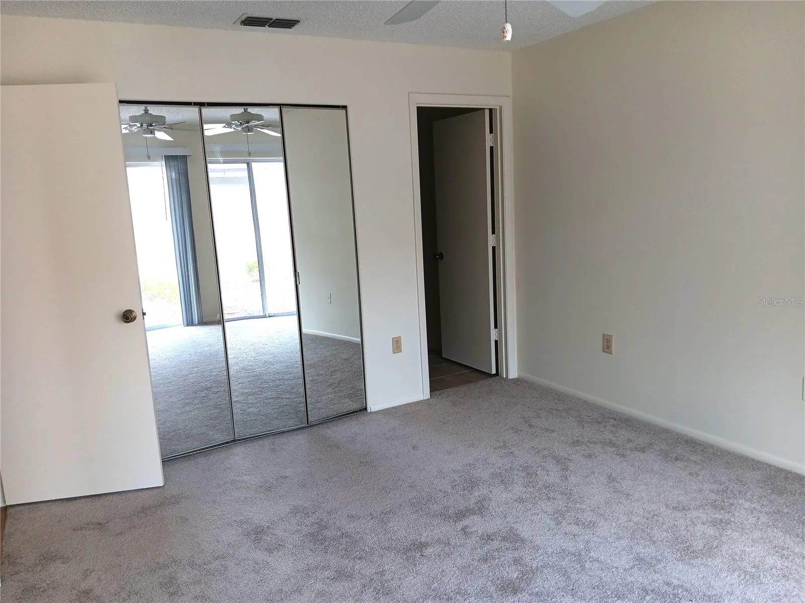 Master bedroom.  Closet is behind the mirrors on the left.