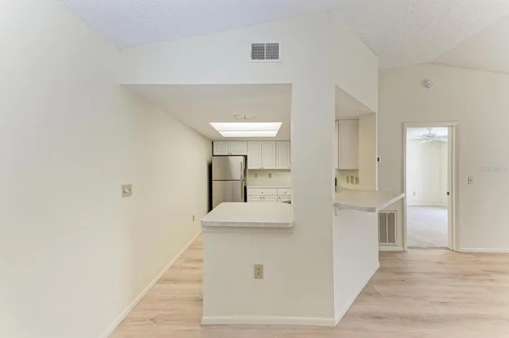 Kitchen straight ahead; living room on the right.