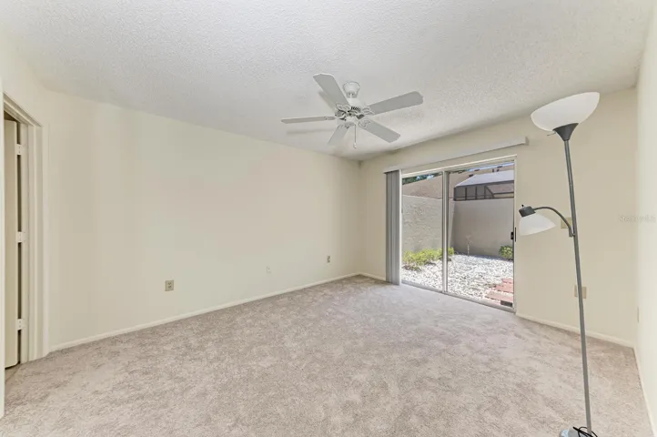 Master bedroom with patio in background
